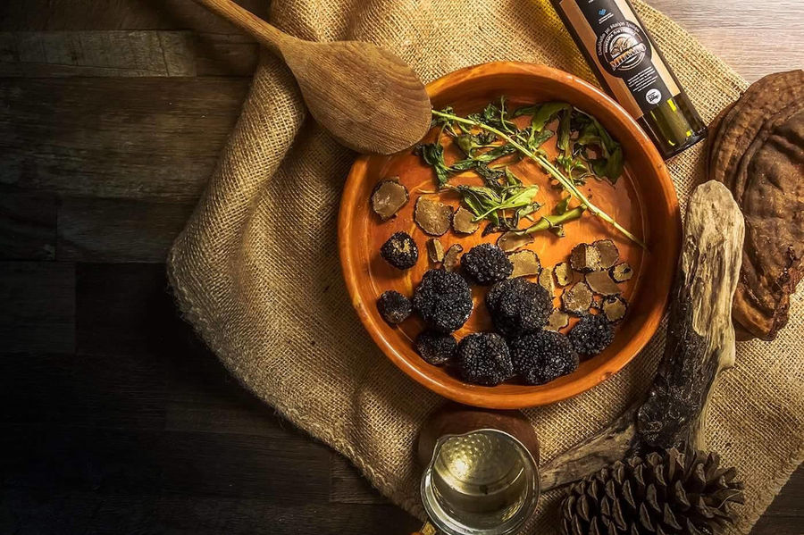 ceramic bowl with truffles and dry moushrooms on sackcloth at 'Mitato Mushrooms Farm'